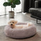 Cama de perro esponjosa redonda y borrosa
